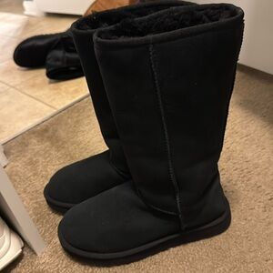 Used tall black Uggs. Still in good condition.